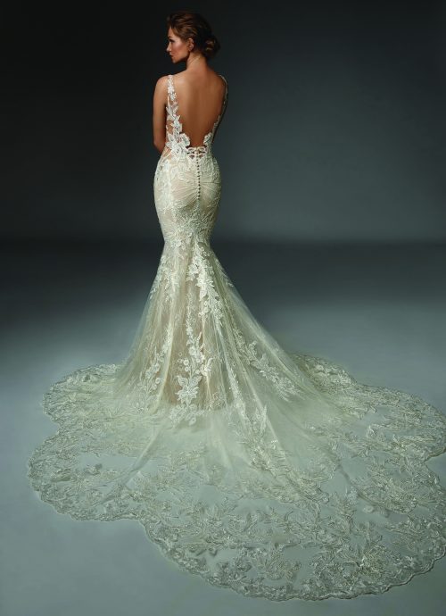 An all lace and sequin fitted Wedding Dress with V neck and deep V Neck Back and a super long and detailed lace and sparkle train