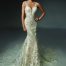 An all lace and sequin fitted Wedding Dress with V neck and deep V Neck Back and a super long and detailed lace and sparkle train