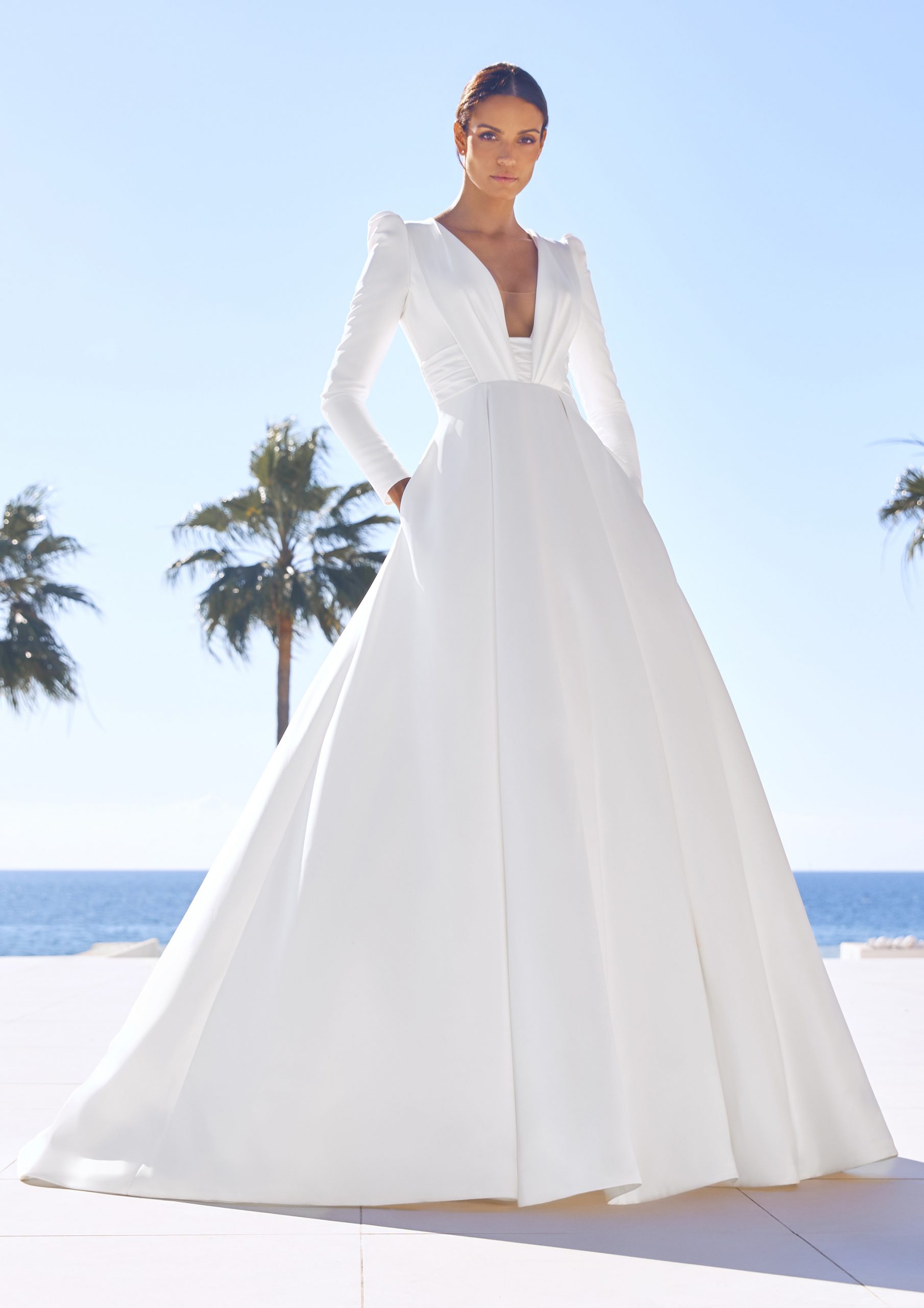 Model wears 2023 Modern Pronovias wedding dress CADENCE available at Romantique Bridal, Magherafelt, Northern Ireland