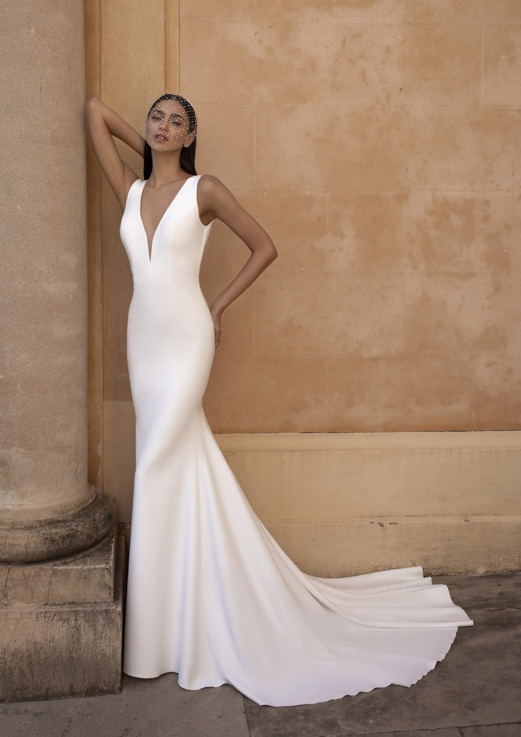 Model wears 2023 Modern Pronovias EUREKA wedding dress available at Romantique Bridal, Magherafelt, Northern Ireland