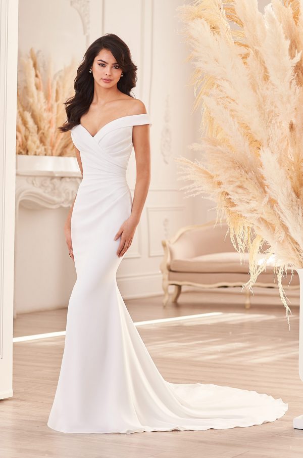 An Off the shoulder Draped Crepe Wedding Dress which is super flattering and enhances your waist