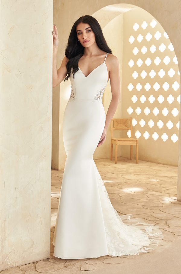 A Luxurious Satin Wedding Dress with thin straps and V Neck and Low back bodice. Lace inserts at the sides and beautiful lace train