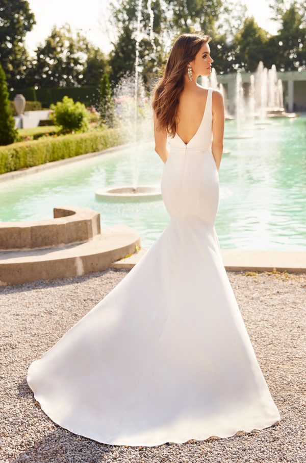 A V-Necked Sleeveless Plain Crepe Wedding Dress with Crepe Belt At Waist.