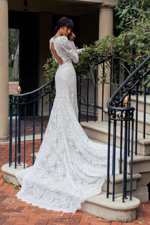A lace lover's dream. A fitted Wedding Dress in full lace, with plunge neckline and low key-hole back. The long sleeves and raised shoulders are vintage-inspired and a beautiful feature of this light weight Wedding Dress.