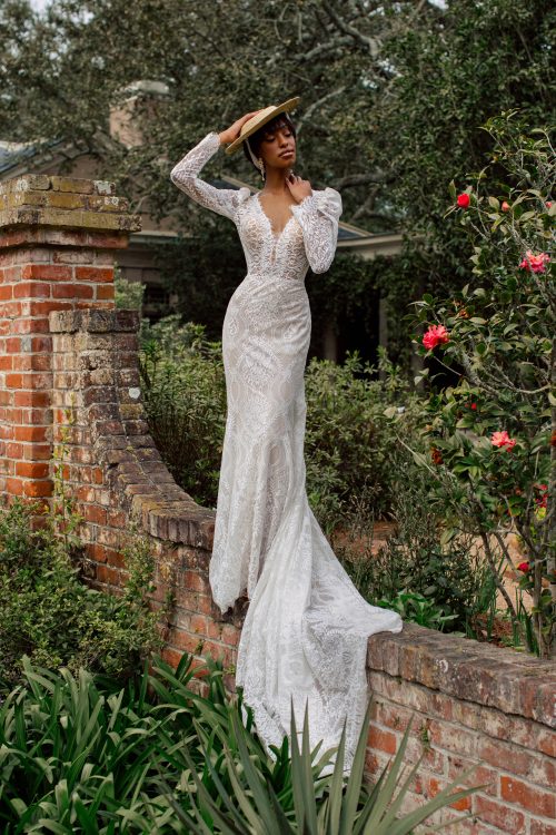 A lace lover's dream. A fitted Wedding Dress in full lace, with plunge neckline and low key-hole back. The long sleeves and raised shoulders are vintage-inspired and a beautiful feature of this light weight Wedding Dress.