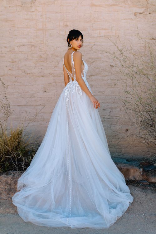Beautiful Romantic and Lightweight Wedding Dress. Lace Sleeveless V-Neck Bodice with a Simple Flowy, super light, layered tulle A-Line Wedding Dress.  Featuring Buttons down the entire back/train. Low, detailed back adds the WOW.
