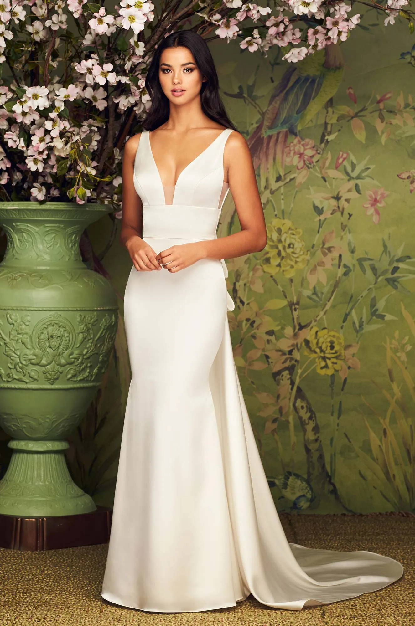 A Luxurious Satin Wedding Dress with Plunging Neck and low back. Detachable Bow and Train. A Bridal Gown with 2 looks